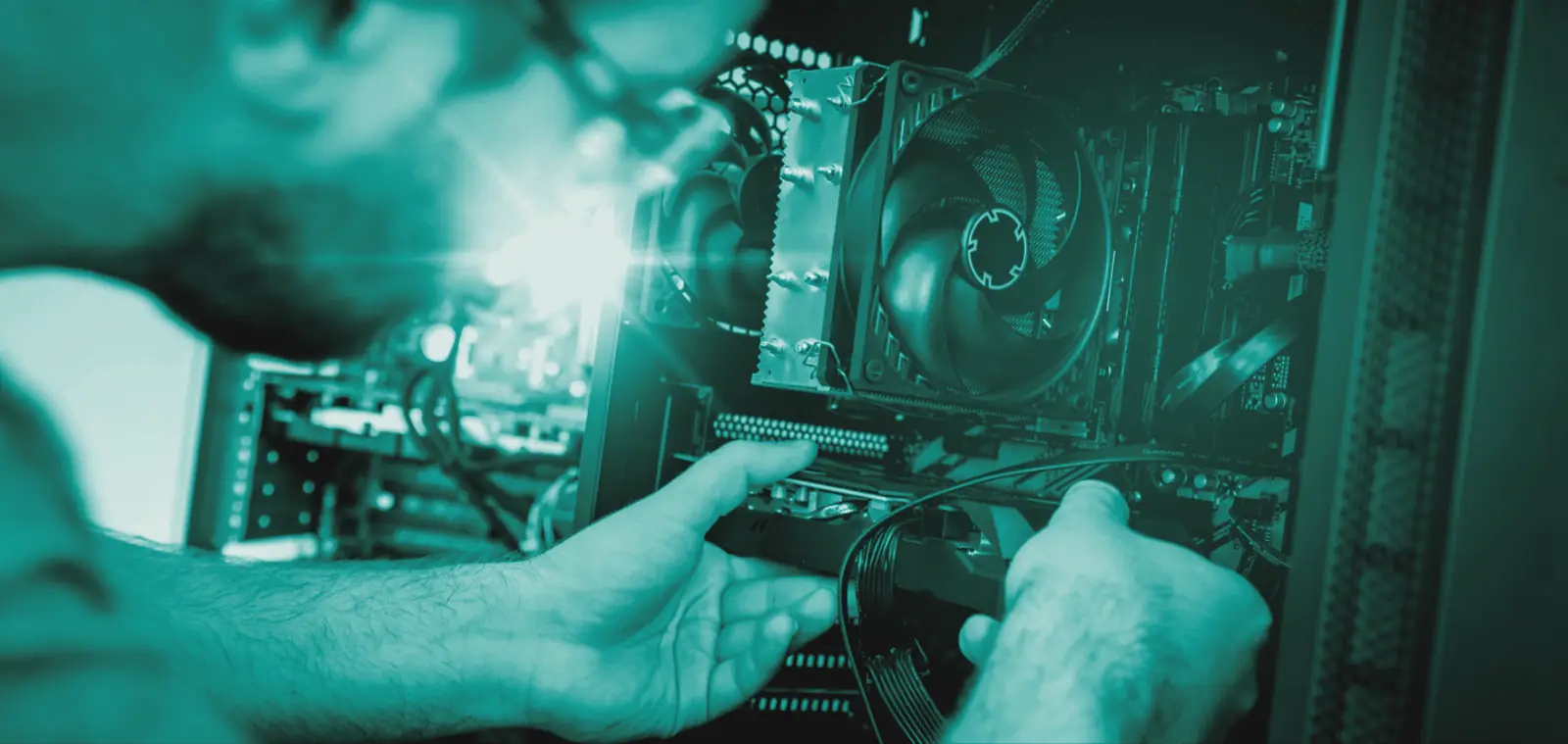 Technician fitting a component inside a computer